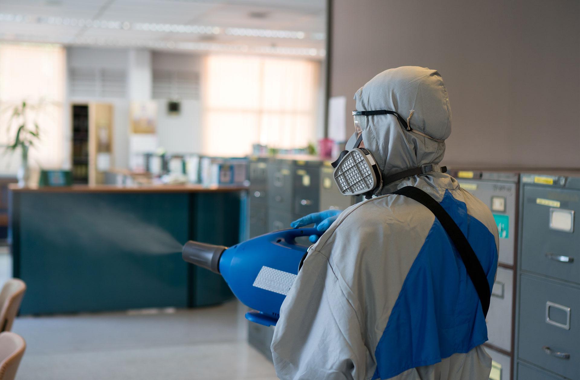 Man with fogging cleaner